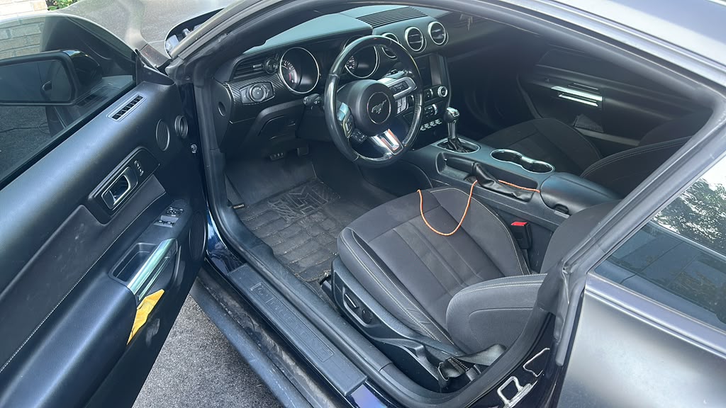 Ford Mustang interior BEFORE detail — dirty floor mats, dusty seats, Flemington NJ