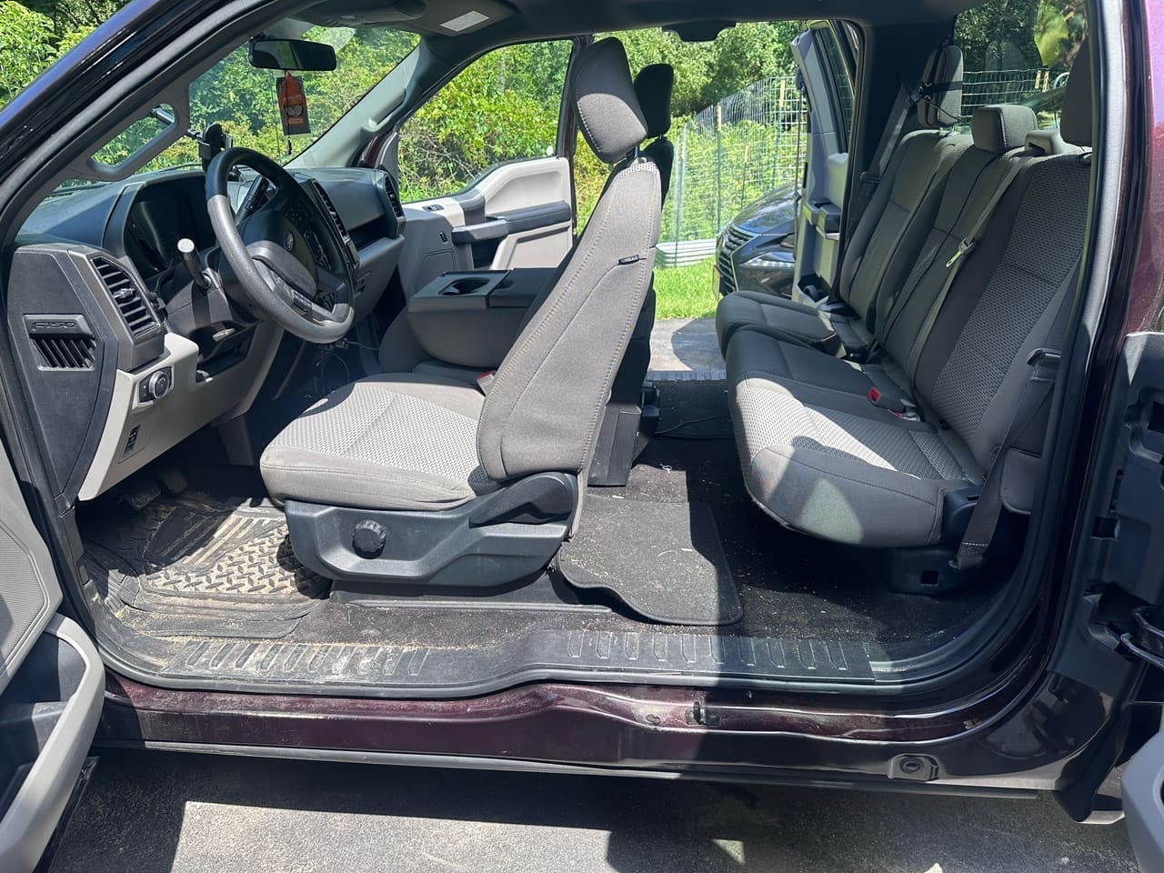 Ford F-150 truck cab BEFORE detail — dirty floor mats and seats, Flemington NJ