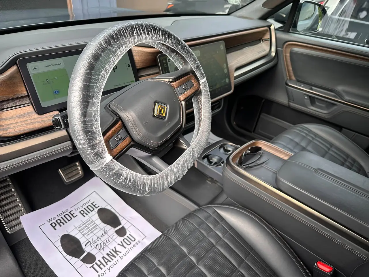 Rivian R1T AFTER interior detail by Detail Jockey — spotless driver floor, clean console and leather seats, NJ